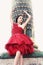 Woman in Paris, dressed in red ballerina dress