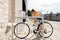 woman parking her bicycle on city street