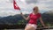 woman on Parpaner Rothorn with flag