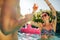 Woman partying with friends in swimming pool