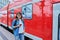 Woman passenger of urban rail transport at modern train station