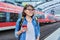 Woman passenger of urban rail transport at modern train station