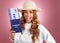 Woman, passport and excited in studio portrait with happiness, identity and plane ticket by gradient background. Happy