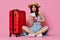 woman with passport and plane ticket red suitcase vacation passenger close-up