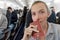 Woman with a passport sitting in airplane interior