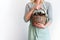 Woman Pastel Clothes Basket Hands Hold Pine Cones