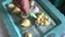 A woman with a pastry bag forms a marshmallow. Different shapes, colors and meanings. The finished product lies on a tray