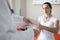 Woman patient signs medical documents at doctor appointment