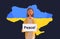 woman patriot holding protest banner pray for Ukraine peace save Ukraine from russia stop war concept