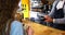 Woman paying bill for goods at counter