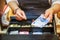 Woman is paying In cash with euro banknotes