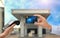 Woman paying for fuel using credit card via payment terminal at gas station, closeup