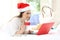 Woman paying on-line on christmas holidays