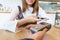 Woman paying money via smartphone with magnetic card concept.