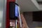 Woman paying at vending machine using smartphone