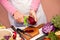 Woman peel beetroot with vegetable peeler