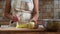 Woman is peeling green aples on the kitchen, slow motion video