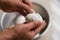 Woman Peeling Hard Boiled Eggs