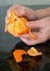 Woman peeling a mandarin orange