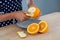 Woman peeling orange