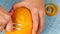 Woman peeling orange zest