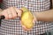 Woman peeling potatoes closeup