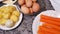 Woman peels boiled eggs from the peel on the salad