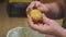 Woman peels boiled potatoes in the kitchen for a salad