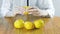 Woman peels a tangerine by hand. Hands close up.