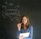 Woman with pen American football strategy on blackboard