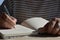 Woman with pen in hand, writing in a journal