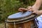 Woman percussionist hands playing a drum