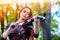 Woman perform music on violin park outdoor. Girl performing jazz .