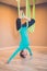 Woman performing antigravity yoga