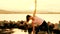 Woman performing Yoga exercises on the beach