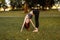 Woman performing yoga in the park. Combination with nature.