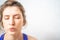 A woman performs breathing exercises during a fitness break. Cleansing the mind and meditation for a healthy mind and