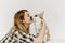 Woman pet corgi dog plays teaches commands