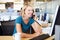 Woman On Phone In Busy Modern Office