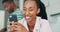 Woman, phone and laughing for communication, kitchen and internet for funny meme or typing. Black couple, happy and