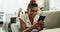 Woman, phone and lying on sofa for communication with smile for conversation, typing in living room of home. Indian