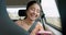 Woman, phone and road trip in car with laugh, meme and comic video on internet on road for travel. Girl, smartphone and