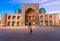 A woman-photographer takes a photograph of one of the main attractions of Bukhara Uzbekistan