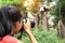 Woman photographer taking photo of panda