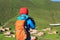 Woman photographer taking picture of traditional tibet village