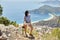 Woman photographer walks along the Lycian Way trail. Fethiye, Oludeniz. Beautiful view of the sea and the beach. Hiking in the