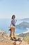 Woman photographer walks along the Lycian Way trail. Fethiye, Oludeniz. Beautiful view of the sea and the beach. Hiking in the