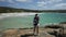 Woman photographer in Waterfall Beach Australia