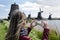 Woman photographer Windmills at Zaanse Schans, Amsterdam, Holland