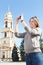Woman photographing city\'s attractions